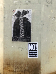 Stencil posters on a concrete wall,  Solidarity graphic, anti fascist art, activist art