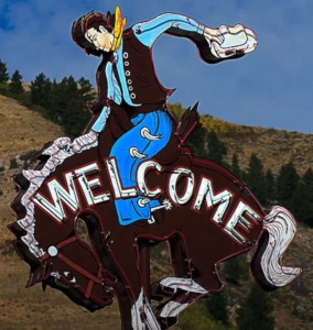 Image of the classic neon sign for Million Dollar Cowboy Bar with bucking bronc & cowboy, Jackson, WY