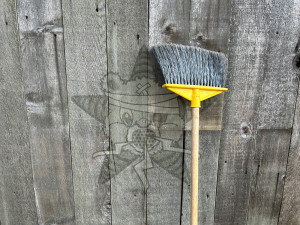 It's an image of a broom next to a shed which has the Self Help Radio logo on it.