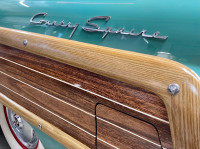 Image of a turquoise colored Country Squire car fender 