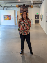 maryanna_ramire in front of Julia Bond's Spectrum Coat, Otherly maryanna_ramire in front of Julia Bond's Spectrum Coat, Otherly